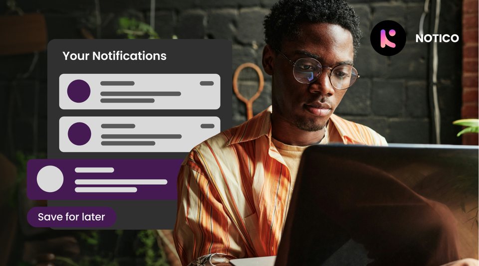 A focused worker at a laptop with a